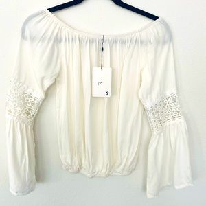 Off the shoulder, white top.